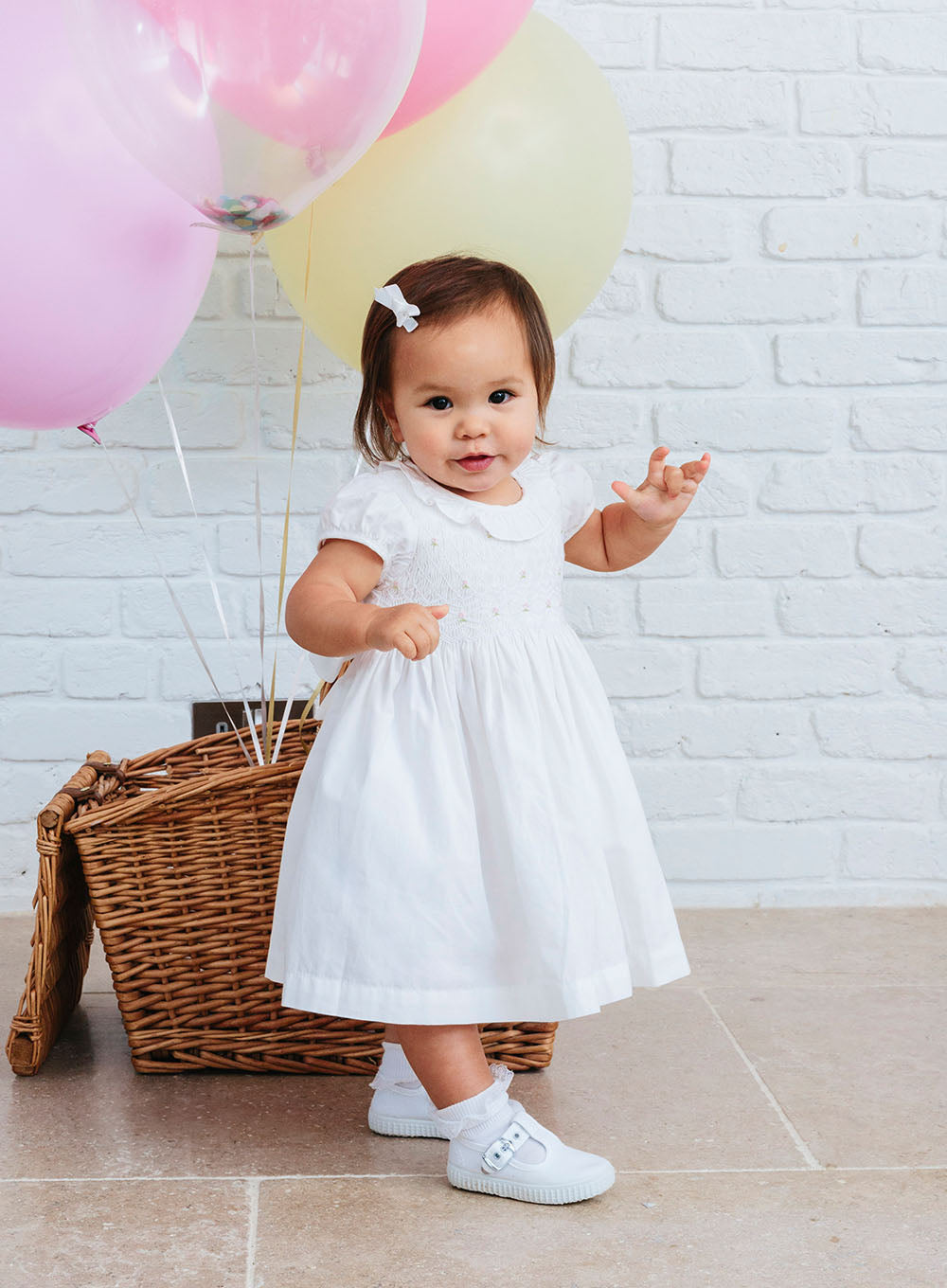 Baby Willow Rose Hand Smocked Dress in White 6/12M - Trotters Baby Willow Rose Hand Smocked Dress in White 6/12M - Trotters