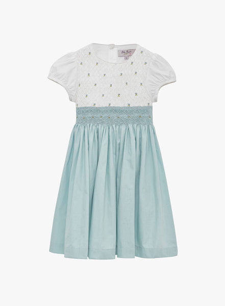 Girls Rose Hand Smocked Dress in Blue | Trotters Trotters Childrenswear USA Girls Rose Hand Smocked Dress in Blue | Trotters Trotters Childrenswear USA
