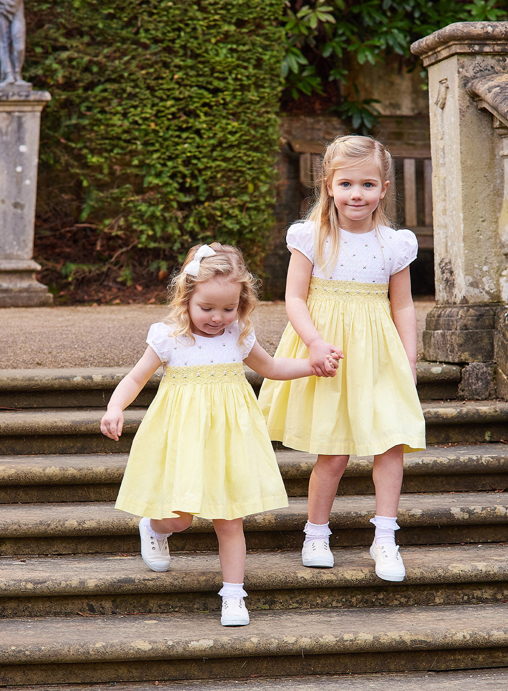 Rose Hand Smocked Dress in Lemon 8/9Y - Trotters Rose Hand Smocked Dress in Lemon 8/9Y - Trotters