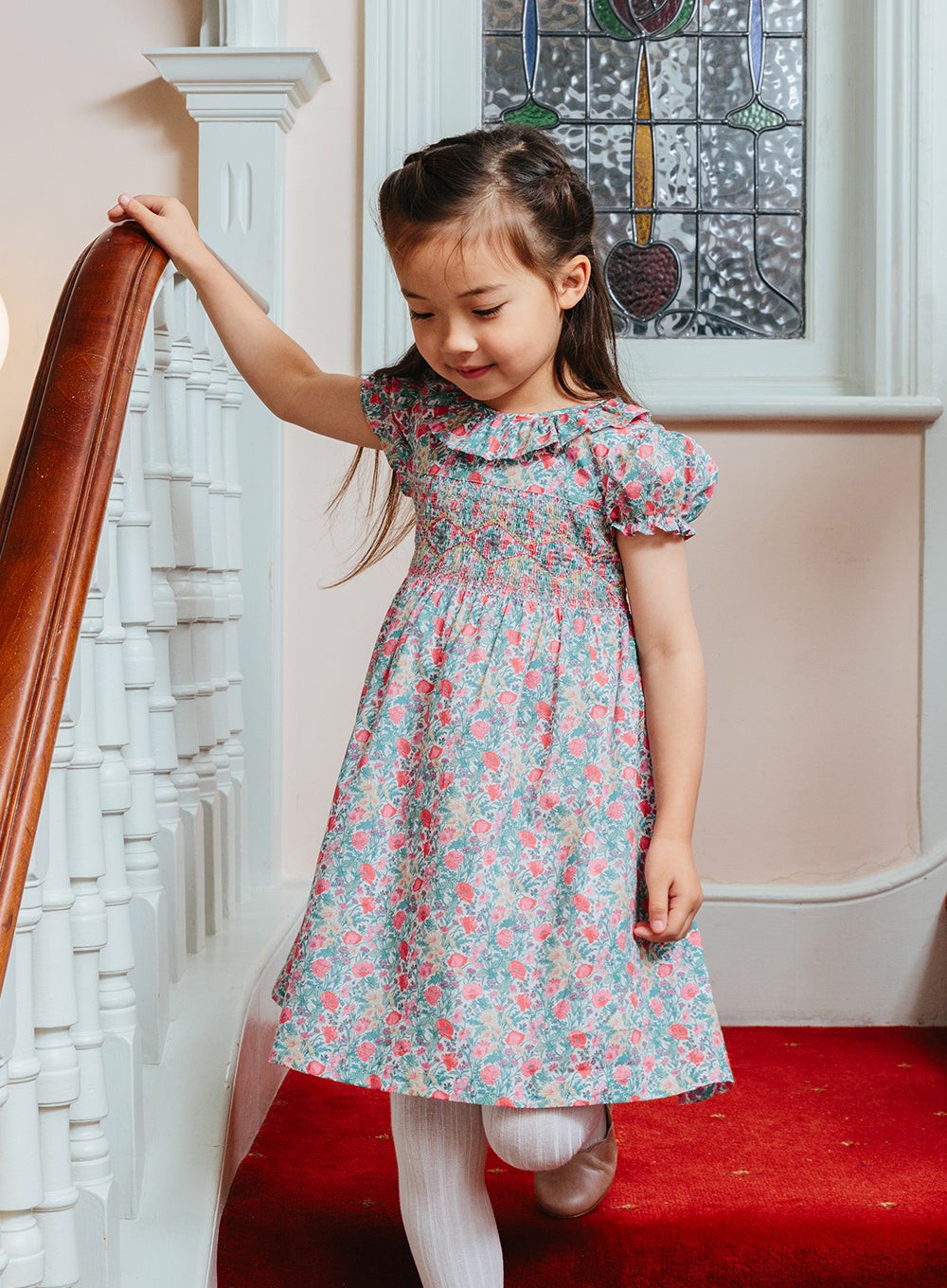 https://www.trotterslondon.com/cdn/shop/products/lily-rose-dress-florence-willow-smocked-dress-30967627120701.jpg?v=1691783264