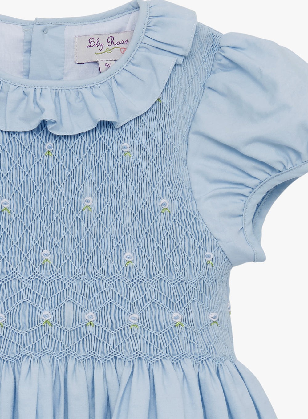 Girls Willow Rose Hand Smocked Dress in Cornflower Blue | Trotters Trotters Childrenswear USA Girls Willow Rose Hand Smocked Dress in Cornflower Blue | Trotters Trotters Childrenswear USA